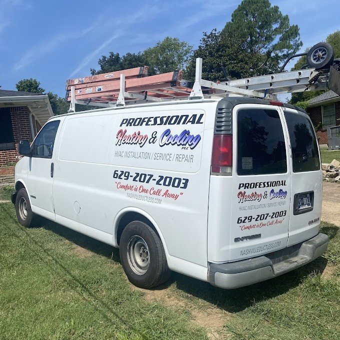 Anthony, the owner and expert HVAC technician of Professional Heating and Cooling, smiling in front of the company van.